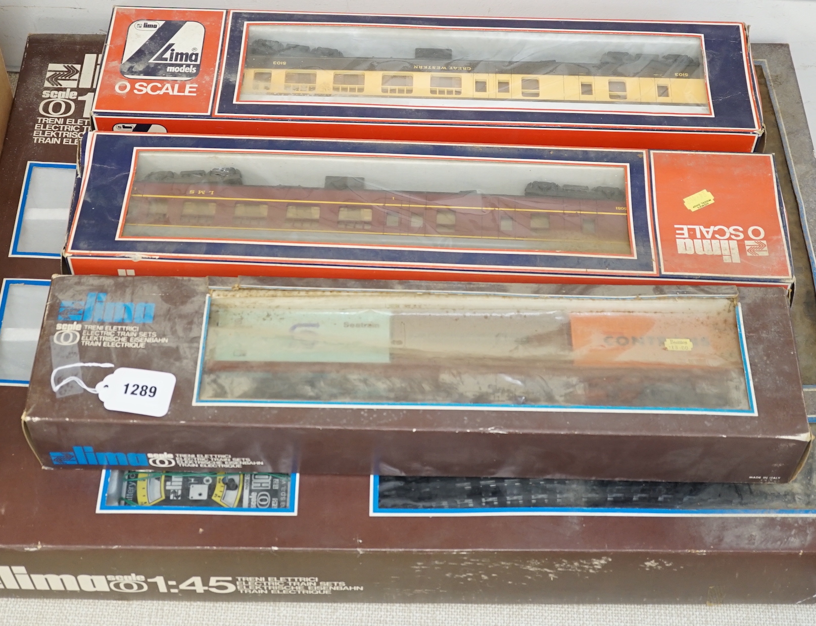 A Lima 0 gauge battery operated train set, together with two additional boxed coaches and a boxed container wagon